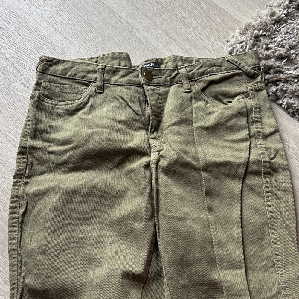 Jeans cropped at the ankle and cuffed. New been stored worn once.